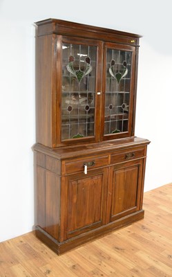 Lot 25 - An early 20th Century Arts & Crafts style glazed bookcase