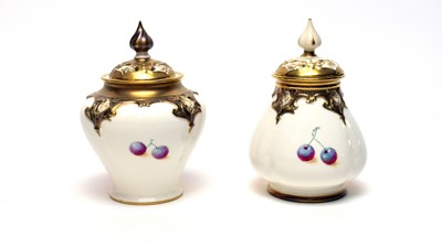 Lot 870 - Two small Royal Worcester pot pourri vases and covers by Roberts