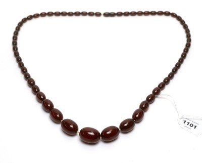 Lot 1101 - An amber style bead necklace