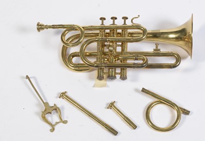 Lot 728 - A brass cornet by Joseph Wallace London.