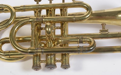 Lot 728 - A brass cornet by Joseph Wallace London.