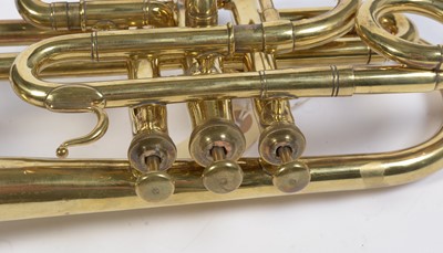 Lot 728 - A brass cornet by Joseph Wallace London.