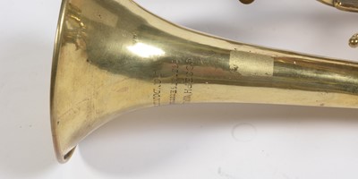 Lot 728 - A brass cornet by Joseph Wallace London.