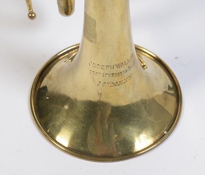 Lot 728 - A brass cornet by Joseph Wallace London.