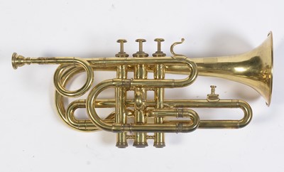 Lot 728 - A brass cornet by Joseph Wallace London.