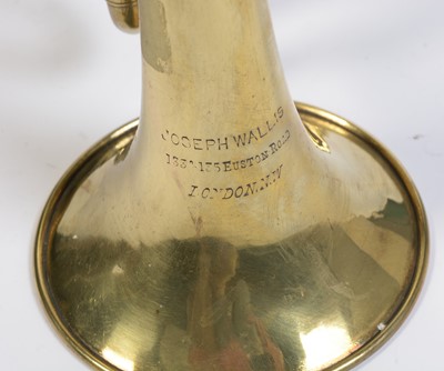 Lot 728 - A brass cornet by Joseph Wallace London.