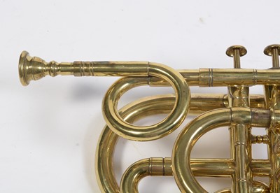 Lot 728 - A brass cornet by Joseph Wallace London.