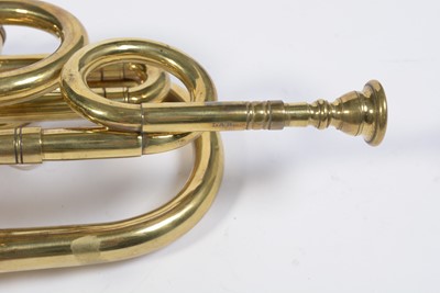 Lot 728 - A brass cornet by Joseph Wallace London.