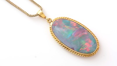 Lot 705 - An opal pendant on chain