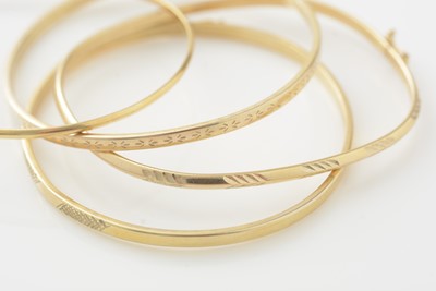 Lot 761 - Four 9ct yellow gold bangles