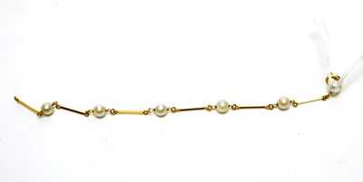 Lot 1100 - A cultured pearl and 18ct yellow gold bracelet