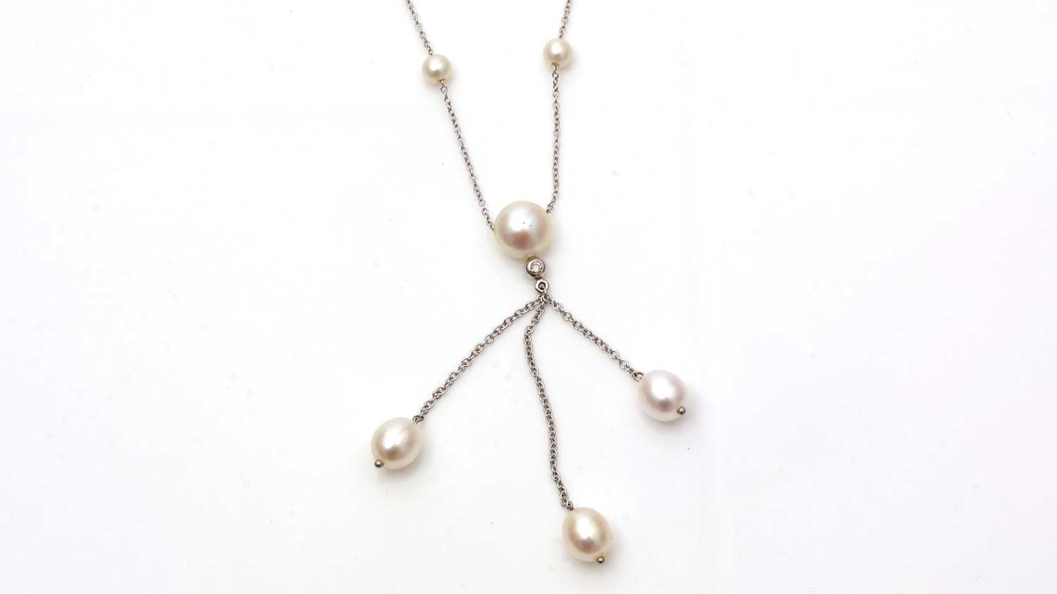 Lot 705 - A cultured pearl and diamond drop necklace