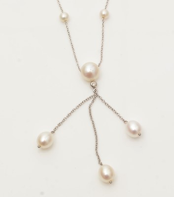 Lot 705 - A cultured pearl and diamond drop necklace