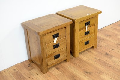 Lot 18 - A pair of contemporary oak furniture land style bedside cabinets