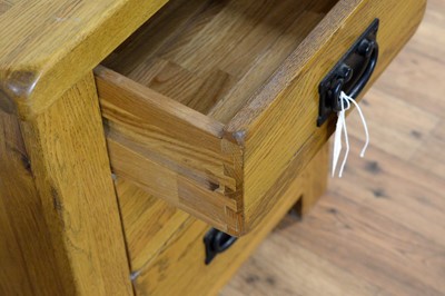 Lot 18 - A pair of contemporary oak furniture land style bedside cabinets