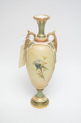 Lot 116 - A Royal Worcester blush ivory twin handled urn vase