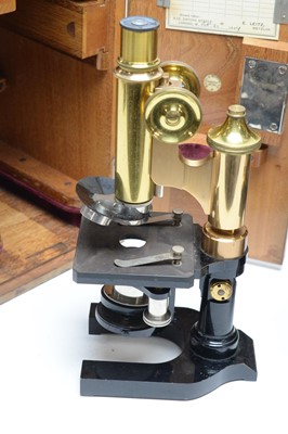 Lot 431 - A J Swift and Son of London ebonised microscope together with a E Leitz Wetzlar microscope