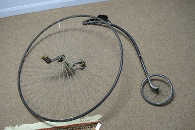 Lot 458 - An early 20th Century penny Farthing front wheel and saddle