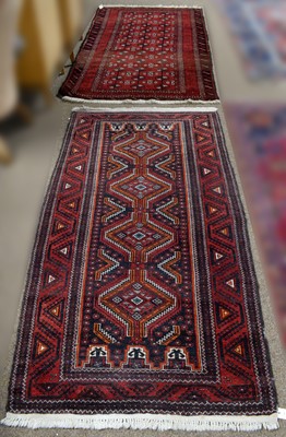 Lot 87 - A 20th Century Persian Baluch rug with another