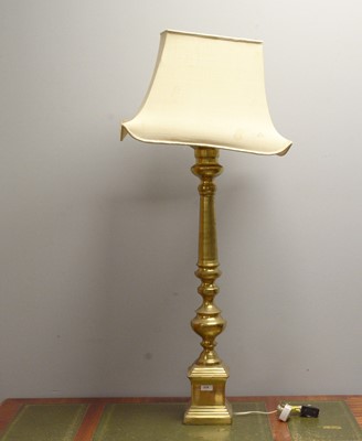 Lot 375 - A pair of brass baluster lamps