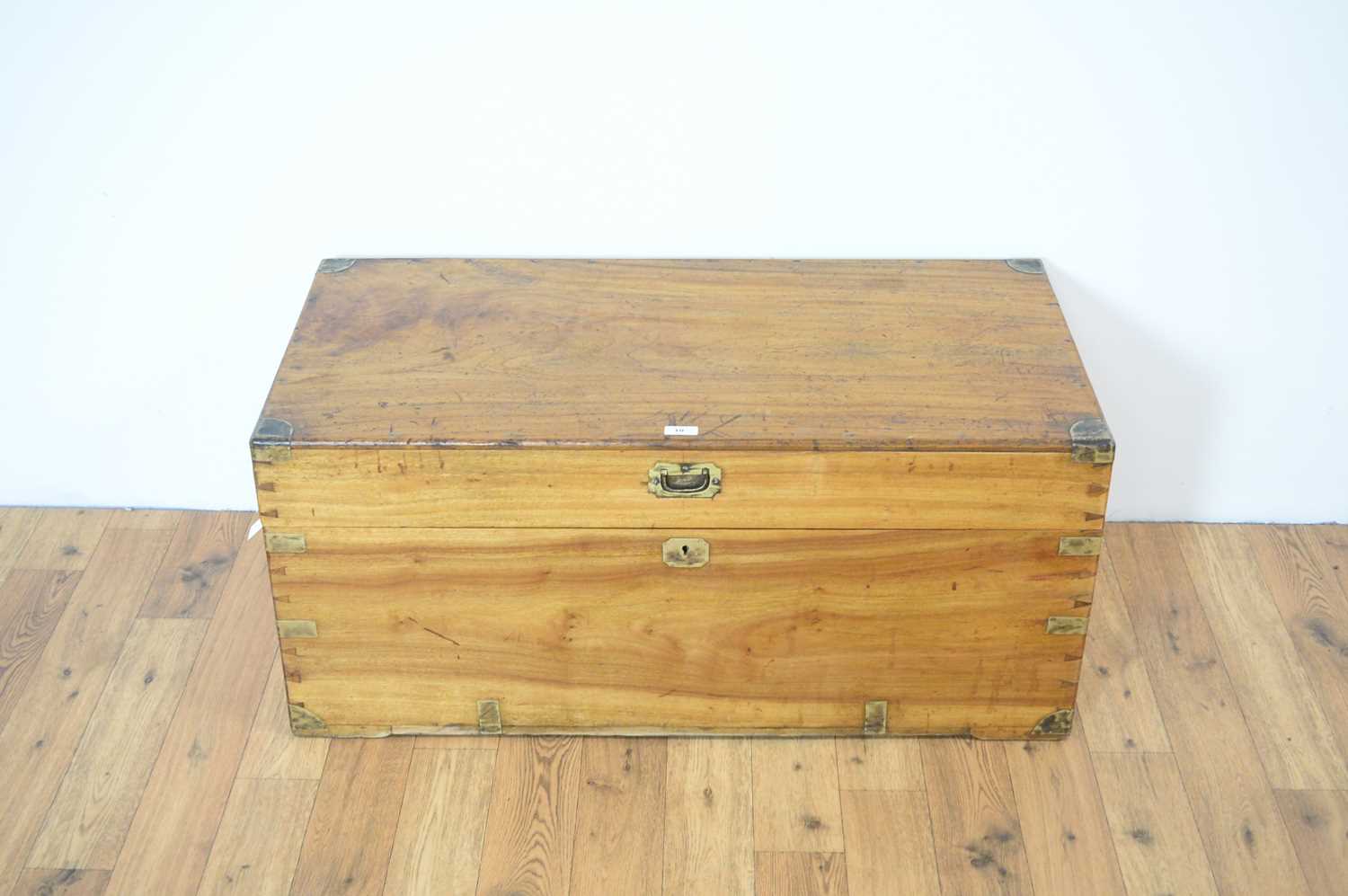 Lot 10 - A  camphorwood and brass strapwork campaign chest