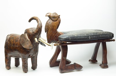 Lot 363 - An Eastern carved wood camel stool