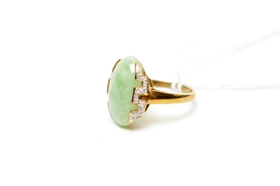 Lot 960 - A 9ct gold, jade and diamond dress ring