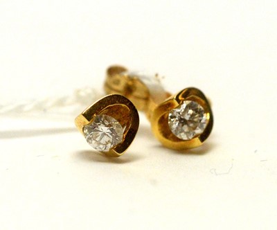 Lot 966 - A contemporary pair of 18ct gold and diamond stud earrings