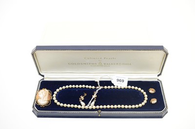 Lot 969 - A cultured pearl necklace and earring set, retailed by Goldsmiths, and a cameo brooch and earrings