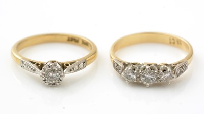 Lot 991 - A three stone diamond ring, and a single stone diamond ring