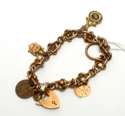 Lot 975 - A 9ct gold fancy-link charm bracelet