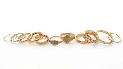 Lot 1079 - A platinum ring; and other gold rings