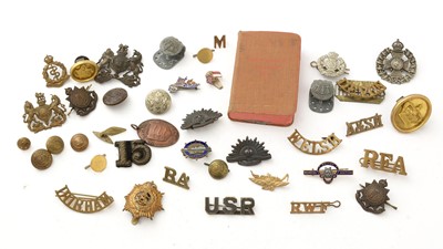 Lot 1092 - A collection of military cab badges, lapels and other items