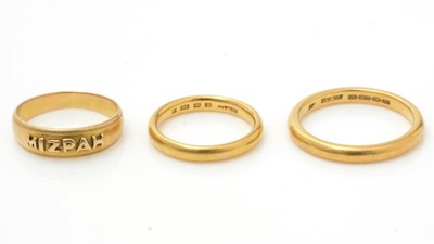 Lot 1116 - Two 22ct yellow gold wedding bands, and an 18ct yellow gold Mizpah ring