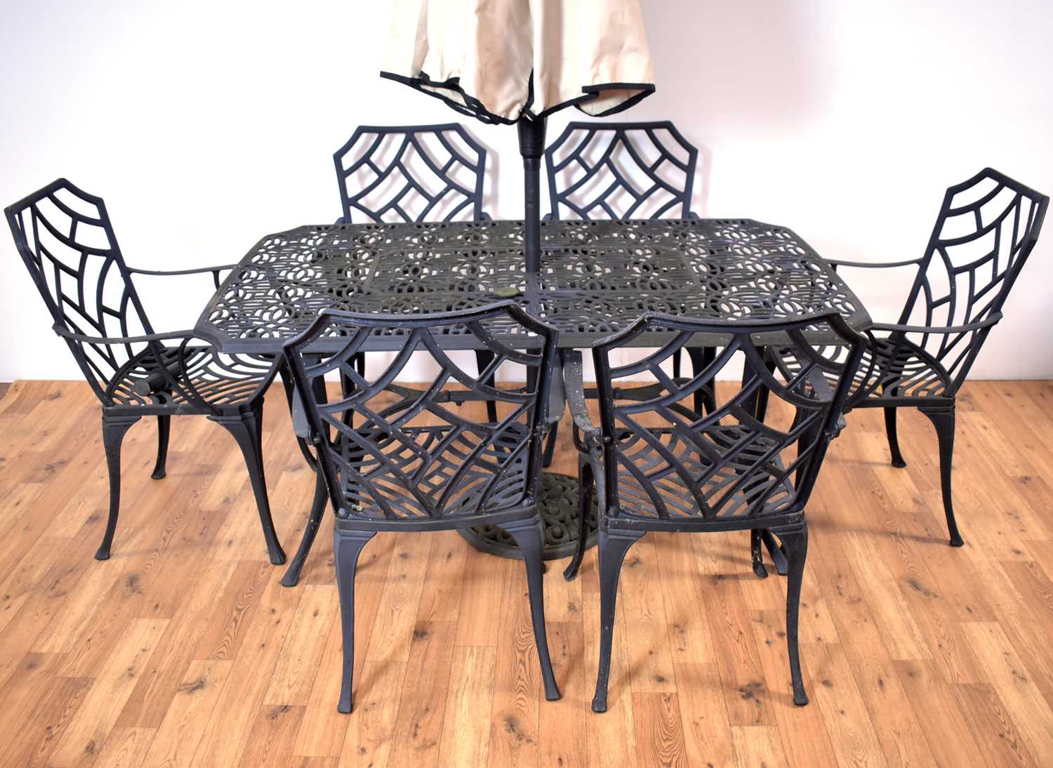 Lot 47 - A contemporary garden table and six chairs