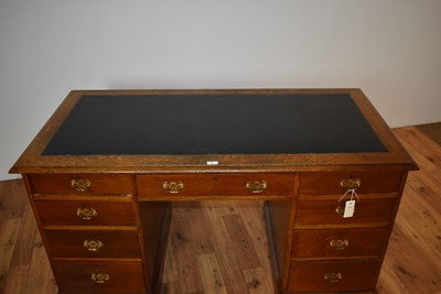 Lot 9 - A late 19th Century oak pedestal writing desk