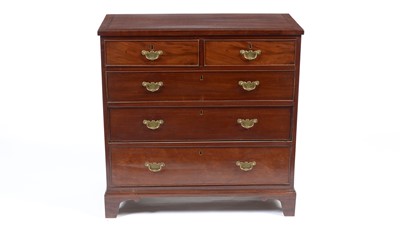 Lot 1495 - A Georgian mahogany and banded chest of drawers