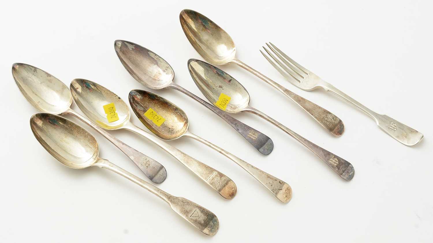 Lot 95 - Seven Georgian silver table spoons in Old English pattern