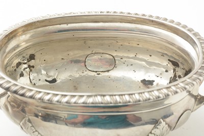 Lot 124 - A pair of Georgian silver sauce tureens with regimental engraved crest