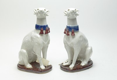Lot 367 - A pair of decorative ceramic faience greyhound dog figures