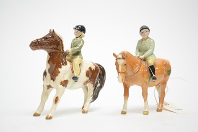 Lot 380 - A pair of Beswick pony club figures