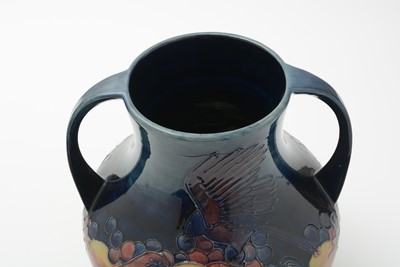 Lot 117 - Moorcroft 'Finch and Berry' twin handles vase