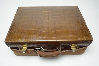 Lot 225 - An early 20th Century brass bound leather vanity case