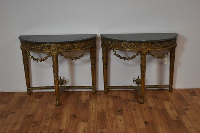 Lot 16 - Pair of ornate Georgian style marble-topped and gold painted demi lune console tables