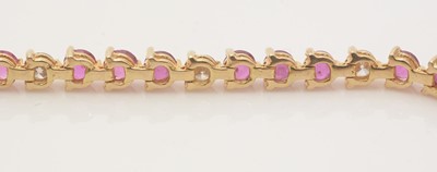 Lot 688 - A diamond and ruby line bracelet