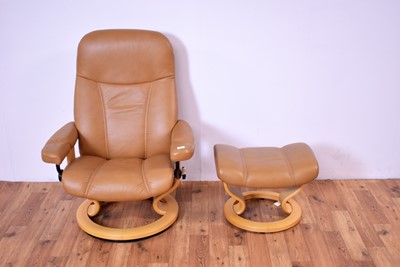 Lot 6 - A contemporary Scandinavian Ekornes Stressless reclining armchair and matching ottoman