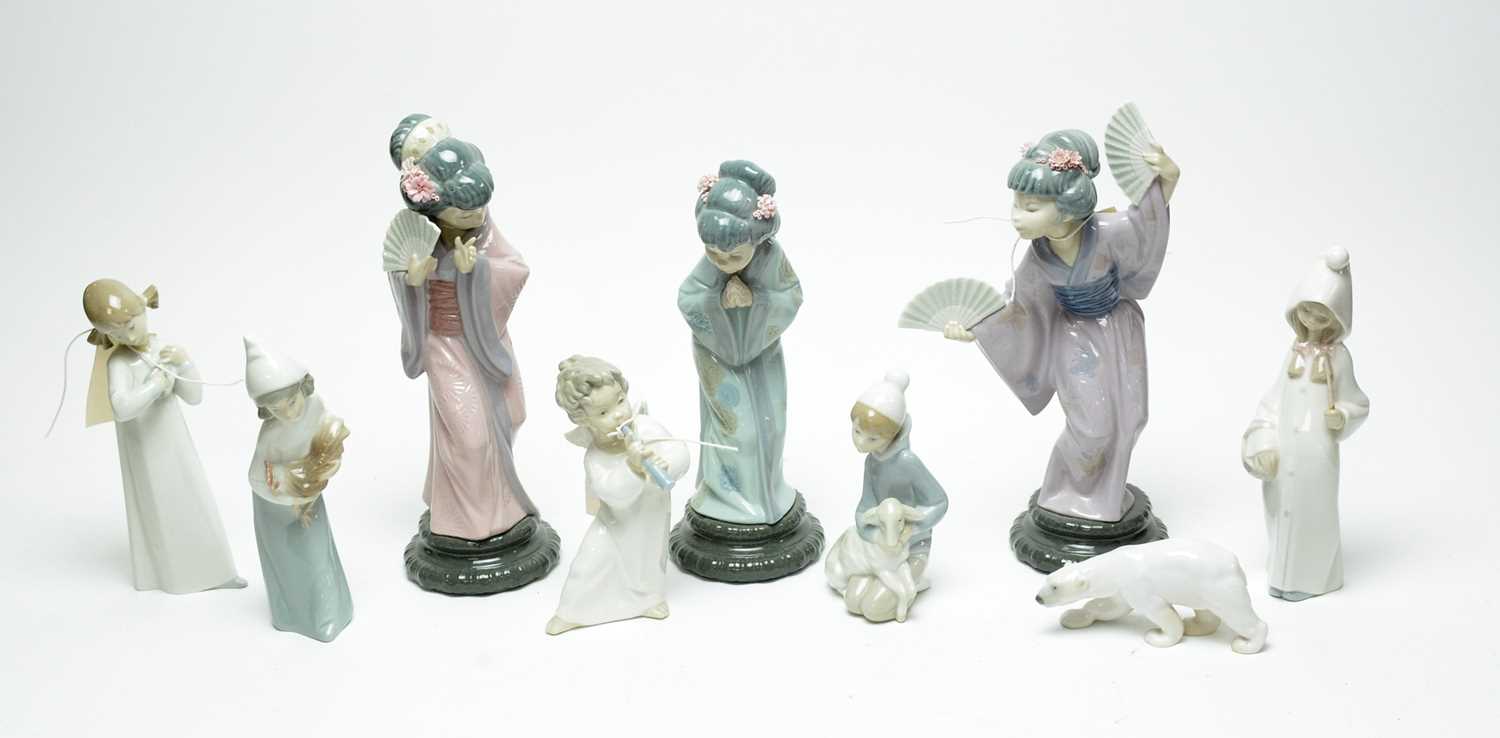 Lot 260 - A collection of decorative ceramic figures