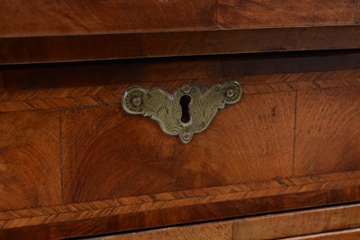 Lot 32 - A George II walnut and feather banded kneehole desk