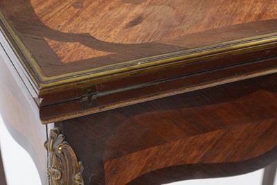 Lot 1434 - A Louis XV style marquetry and banded walnut card table