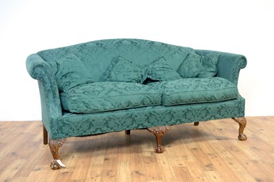 Lot 16 - A 20th Century two seater sofa upholstered in green patterned fabric